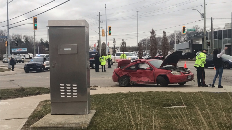 A red sedan with heavy damage is seen at the intersection of King Street and Deer Ridge Drive on March 26, 2024. (Chris Thomson/CTV Kitchener)
