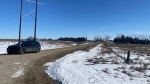 An unmarked RCMP vehicle sits outside the entrance to a rural property near Neudorf, Sask. (Sierra D'Souza Butts/CTV News) 