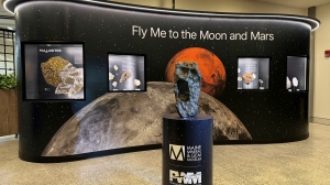 This photo by Darryl Pitt shows an installation at Portland International Jetport in Maine that features a large piece of the moon on March 20, 2024. The installation, which went live Tuesday, March 26, 2024, features the second largest piece of the moon on Earth. (Darryl Pitt via AP)
