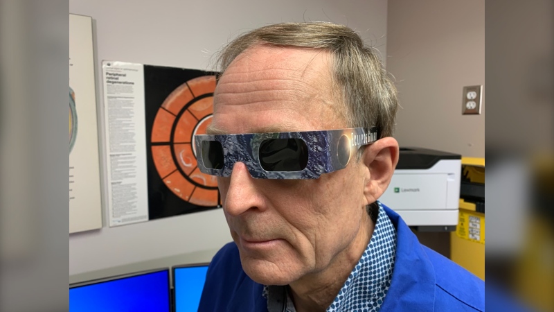 Ivey Eye Institute ophthalmologist Dr. Phil Cooper sports a pair of special purpose solar eclipse glasses in London, Ont. on March 26, 2024. (Bryan Bicknell/CTV News London)