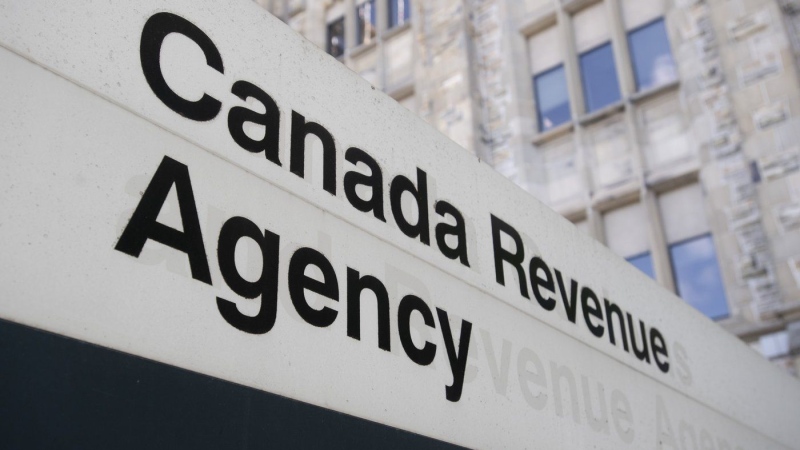 A sign outside the Canada Revenue Agency is seen Monday May 10, 2021 in Ottawa. The Canada Revenue Agency has now fired more than 200 people for falsely claiming a federal income benefit during the COVID-19 pandemic. THE CANADIAN PRESS/Adrian Wyld