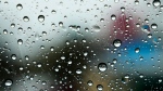 Rain drops collect on a car window. (AP Photo/Nam Y. Huh)