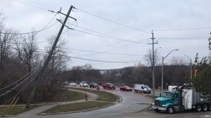 A damaged hydro pole is seen near the intersection of Water and Ainslie streets on March 27, 2024.(Chris Thomson/CTV Kitchener)