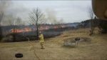 Firefighters at the scene of a brush fire near Carp on Tuesday, March 26 2024. Ottawa Fire says it has responded to at least one brush fire a day since March 15. (Ottawa Fire Services/Helmet Cam)