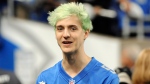 In this Sept. 10, 2018, file photo, Fortnite superstar Tyler 'Ninja' Blevins watches before an NFL football game between the Detroit Lions and New York Jets in Detroit. (AP Photo / Jose Juarez, File)