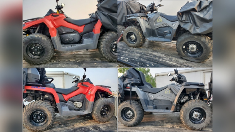 A red 2021 Can Am Outlander 570 with Alberta licence plate CNM32 and VIN 3JBLMAT49MJ000656 and a grey 2021 Polaris Sportsman Touring 570 with Alberta licence plate NKA73 and VIN 4XASDE575MA293420 were stolen along with a trailer, all of which were owned by Grande Prairie RCMP, from a community compound in Clairmont, Alta., on March 25, 2024. (Source: RCMP) 
