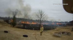 Ottawa firefighters battling a fire in the community Corkery on Tuesday. Ottawa Fire says it has responded to at least one brush fire a day since March 15. 