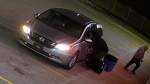 Security video images show two suspects outside of a south-end Barrie, Ont. plaza and a newer model silver Honda Odyssey van without plates on Tues., March 26, 2024. (Source: Barrie Police Services)