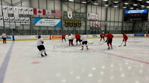 Regina Fire's hockey team prepares for its game against Regina Police Service. (BritDort/CTVNews)