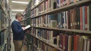 Dale Storie, Chair of the Multitype Library Board tours the halls of the University of Regina's John Archer Library. (Morgan Campbell/CTV News)