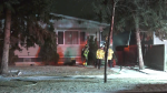 A fire that broke out in a duplex at 128 Avenue and 123A Street spread to a neighbouring home on March 28, 2024. (Evan Klippenstein / CTV News Edmonton) 