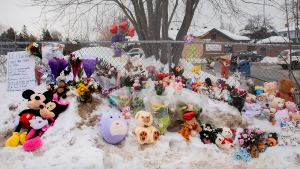 A memorial is shown at the site of the daycare centre bus crash in Laval, Que., Thursday, Feb. 9, 2023. (Graham Hughes, The Canadian Press)
