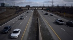 Vehicles make their way on Highway 174 in Ottawa, on Thursday, March 28, 2024. The province announced Thursday that it will take over ownership of the highway, support the repairs of major connecting roads and open a new police station downtown. (Justin Tang/THE CANADIAN PRESS)