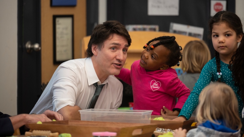 Prime Minister Justin Trudeau chats with children at a child care at Don Christian Recreation Centre in Surrey, B.C on Thursday, March 28, 2024. THE CANADIAN PRESS/Tijana Marti