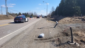 Provincial police attend the scene of a collision involving a vehicle and a light post on Highway 9 in Caledon, Ont. (Source: OPP/X)