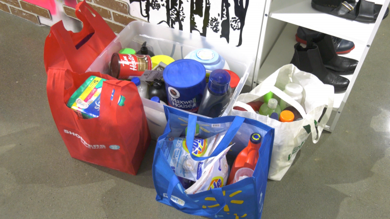 Donations of laundry detergent, body wash and other daily needs sit at Mod Uncorked on March 28, 2024, after the consignment store launched a donation drive for Edmonton's Bissell Centre and Boyle Street Community Services. (Evan Klippenstein / CTV News Edmonton) 