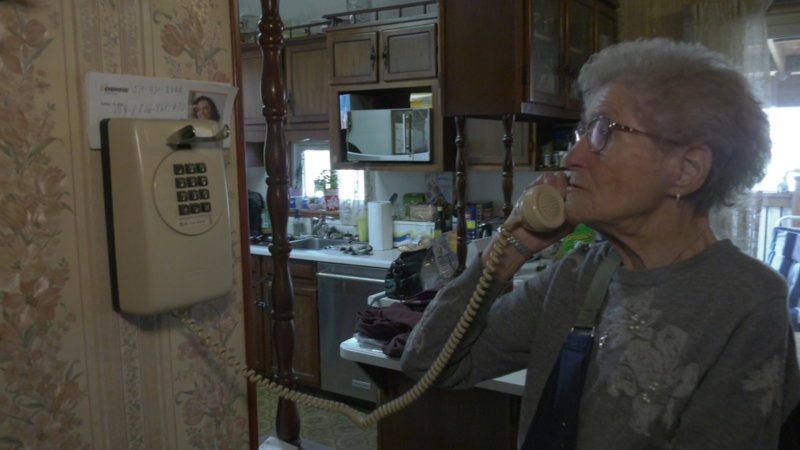 Mabel Beharrell of London, Ont., seen on March 28, 2024, receives fraud calls on her telephone. (Bryan Bicknell/CTV News London) 