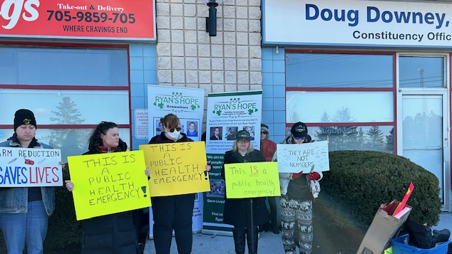 Protesters in front of MPP Doug Downey’s office in Barrie Ont., on March., 28, 2024. (CTV News/Mike Lang)