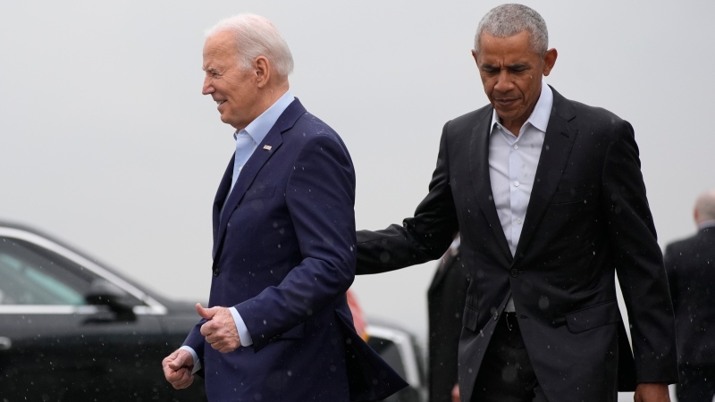 U.S. President Joe Biden, left, and former U.S. President Barack Obama arrive at John F. Kennedy International Airport, Thursday, March 28, 2024, in New York. (AP Photo/Alex Brandon) 