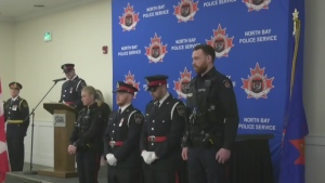 Four new police officers were presented their badges and took the oath of honour during a ceremony in North Bay on March 28, 2024. (Angela Gemmill/CTV News Northern Ontario)