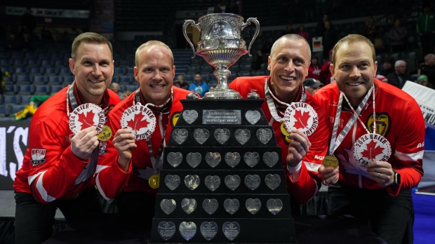 Canada skip Brad Gushue, from left to right, third Mark Nichols, second E.J. Harnden and lead Geoff Walker pose with the Brier Tankard and First Nations beadwork after defeating Saskatchewan in the final at the Brier, in Regina, Sunday, March 10, 2024. THE CANADIAN PRESS/Darryl Dyck