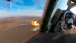 This photo taken from video released by the Russian Defense Ministry Press Service on Wednesday, March 27, 2024, shows a Su-25 ground attack jet of the Russian air force firing rockets during a mission over Ukraine. (Russian Defense Ministry Press Service via AP)