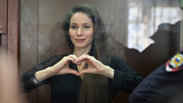 Antonina Favorskaya stands in a glass cage in a courtroom in the Basmanny District Court in Moscow, Russia, Friday, March 29, 2024. (AP Photo / Dmitry Serebryakov)
