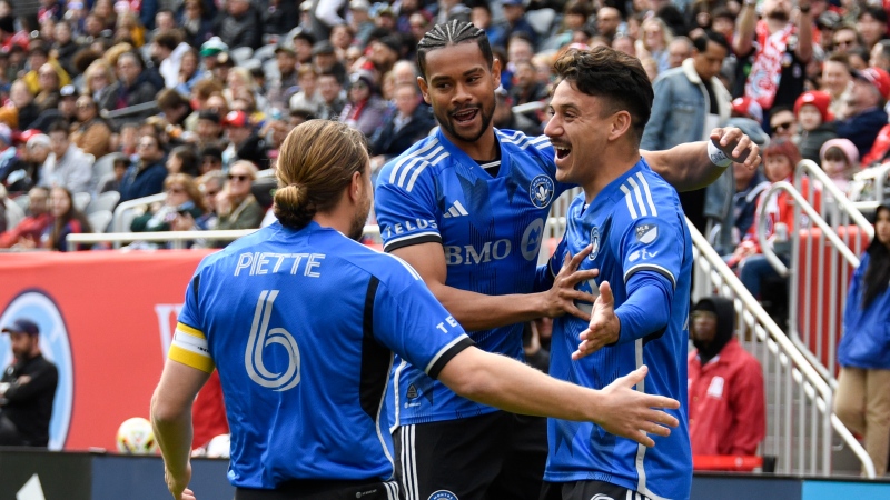 CF Montréal forward Chinonso Offor (9) celebrates with midfielder Samuel Piette (6) forward Ariel Lassiter, center, after he scores a goal during the first half of an MLS soccer match against the Chicago Fire, Saturday, March 16, 2024, in Chicago. (Matt Marton, the Canadian Press)