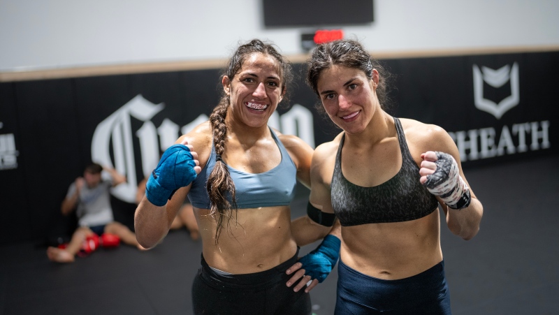 Sisters Ana (left) and Lupita 'Loopy' Godinez are shown during a workout in Las Vegas in a March 18, 2024, handout photo. THE CANADIAN PRESS/Handout: UFC Espanol, Juan Cardenas