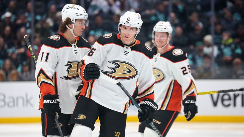 Anaheim Ducks' Trevor Zegras, from left, Ryan Strome and Brock McGinn celebrate after Zegras' goal during the second period of an NHL hockey game against the Seattle Kraken on Tuesday, March 7, 2023, in Seattle. (AP Photo/Jason Redmond)
