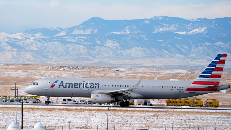 An American Airlines jetliner rumbles down the runway for take off from Denver International Airport after a winter storm swept through the region Tuesday, Jan. 16, 2024, in Denver. (AP Photo/David Zalubowski) 