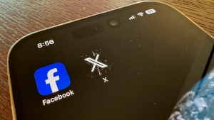 App logos for Facebook, left, and X, formerly known as Twitter, are seen on a mobile phone in Los Angeles, Saturday, March 16, 2024. (AP Photo/Paula Ulichney) 