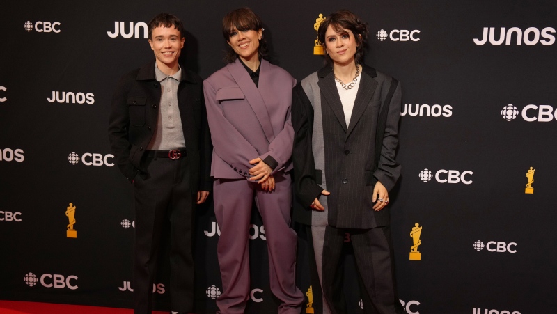 Elliot Page poses with Tegan and Sara as they arrive on the red carpet for the Juno awards, in Halifax, Sunday, March 24, 2024. (Chris Young)