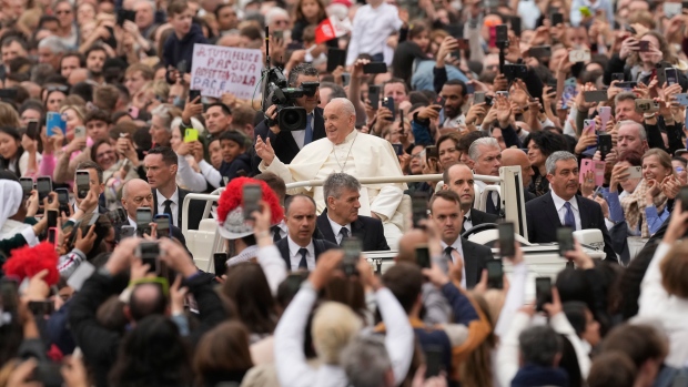Pope Francis waves faithful as he smiles after celebrating Easter mass in St. Peter's Square at the Vatican, Sunday, March 31, 2024. (AP / Andrew Medichini)