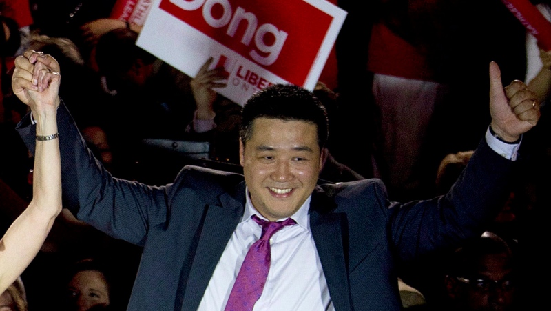 MP Han Dong celebrates with supporters in Toronto on Thursday, May 22, 2014. THE CANADIAN PRESS/Nathan Denette