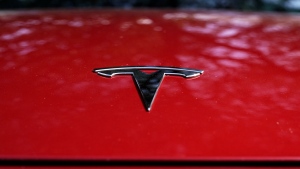 A Tesla logo is seen on a vehicle on display in Austin, Texas, Feb. 22, 2023. (AP Photo/Eric Gay, File)