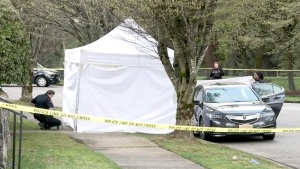 Police investigate the death of a woman in South Vancouver on April 3, 2024. 