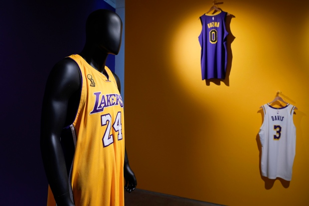 NBA basketball jerseys, including one worn by Kobe Bryant during Game 1 of the 2009 finals, left, are displayed during a preview at Sotheby's in New York, Thursday, April 4, 2024. (AP Photo/Seth Wenig)