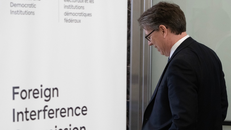 Elections Canada Chief Electoral Officer Stephane Perrault enters the Public Inquiry Into Foreign Interference in Federal Electoral Processes and Democratic Institutions following a break , Thursday, March 28, 2024 in Ottawa. THE CANADIAN PRESS/Adrian Wyld