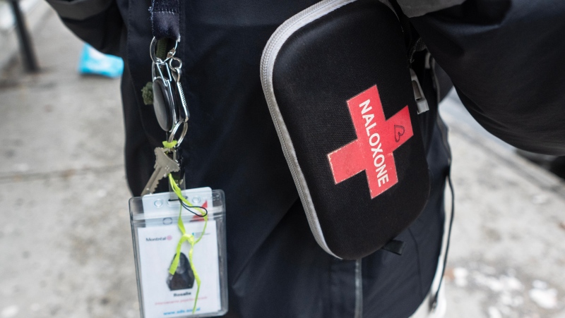 Rosalie, from the EMMIS street intervention team, wears Naloxone, an overdose medication, during her tour on Monday, October 23, 2023 in Montreal. (Ryan Remiorz/The Canadian Press)