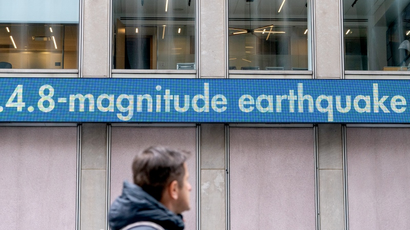 A digital ticker tape board at News Corp Headquarters displays the news of a 4.8 magnitude earthquake on April 5, 2024 in New York City. ( David Dee Delgado/Getty Images)