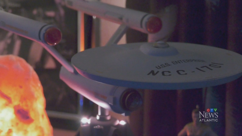A mini U.S.S. Enterprise sits on a desk in Roach's room. (CTV/Mike Lamb)