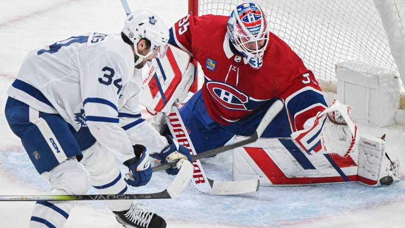 Toronto Maple Leafs' Auston Matthews moves in on Montreal Canadiens goaltender Sam Montembeault during first period NHL hockey action in Montreal, Saturday, April 6, 2024. THE CANADIAN PRESS/Graham Hughes