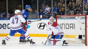 New York Rangers centre Mika Zibanejad (93) scores past Montreal Canadiens goaltender Cayden Primeau (30) and defenceman Jayden Struble (47) during the third period of an NHL hockey game, Sunday, April 7, 2024, at Madison Square Garden in New York. (AP Photo/Mary Altaffer)