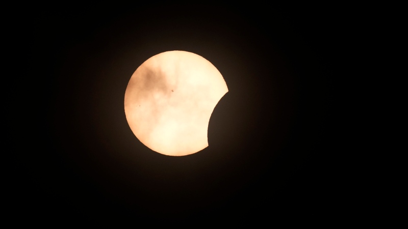 The beginning of a solar eclipse, as seen from Fort Worth, Texas, Monday, April 8, 2024. (AP Photo/LM Otero)