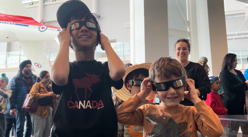 Kids at the Canada Aviation and Space Museum don their protective eyewear in preparation of the solar eclipse in Ottawa on April 8, 2024. (Jackie Perez/CTV News Ottawa)