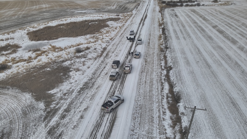 RCMP vehicles can be seen surrounding the suspect vehicle on Range Road 200 near Edgeley, Sask. (Courtesy: Saskatchewan RCMP)
