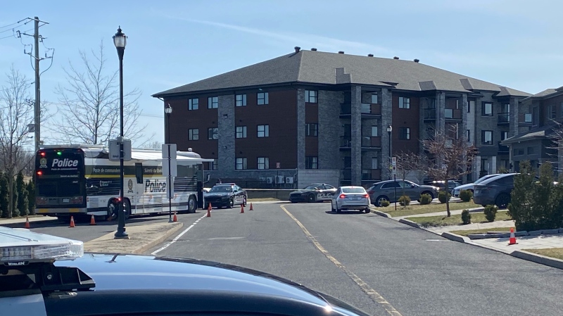Roussillon police cars outside a residential building in Candiac, Que. on Tuesday, April 9, 2024, after the suspicious death of a woman. (Dave Touniou/CTV News)
