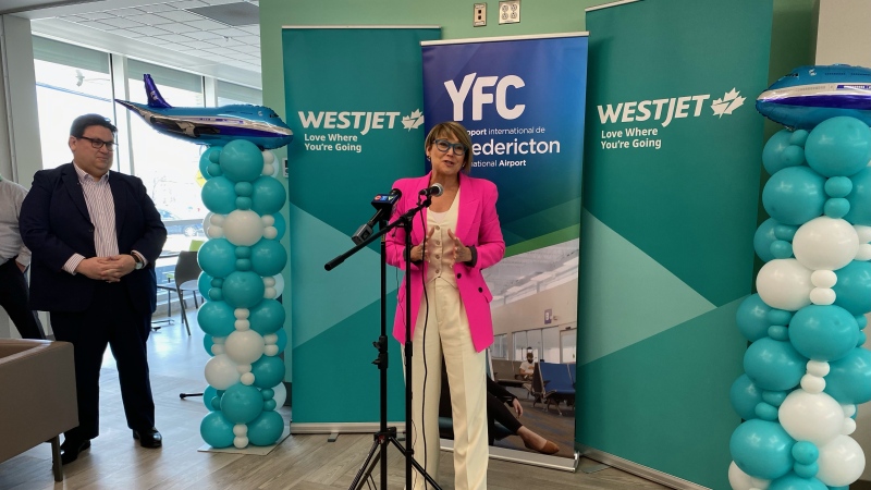 WestJet vice president of external affairs Andy Gibbons and Fredericton International Airport president and CEO Johanne Gallant announce the return of WestJet to the terminal on April 9, 2024. (Source: Avery MacRae/CTV News Atlantic)