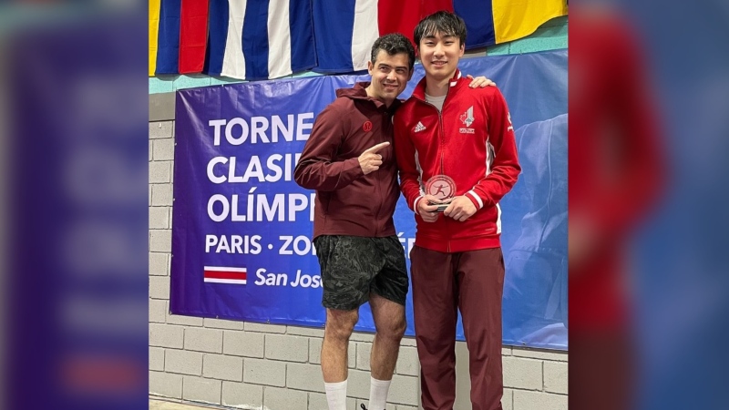 Nicholas Zhang (right) and his coach Igor Gantsevich (left) at the Olympics qualifier in Costa Rica. (Courtesey: Igor Gantsevich) 